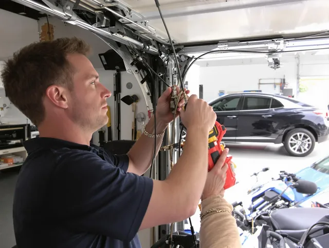 Somers Garage Door Repair safety certified technician performing cable replacement in Somers