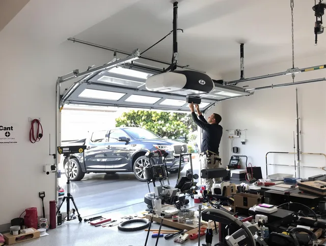 Somers Garage Door Repair specialist installing smart garage door opener system in Somers home