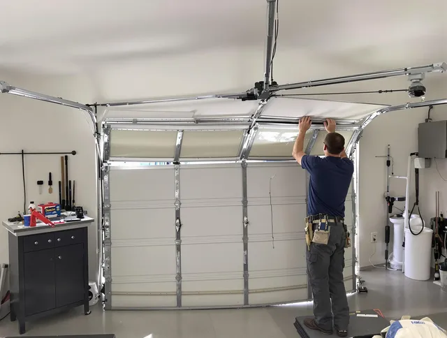 Somers Garage Door Repair specialist performing precise section replacement on Somers garage door